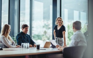 Smiling lawyers having a casual conversation during a meeting in a conference room